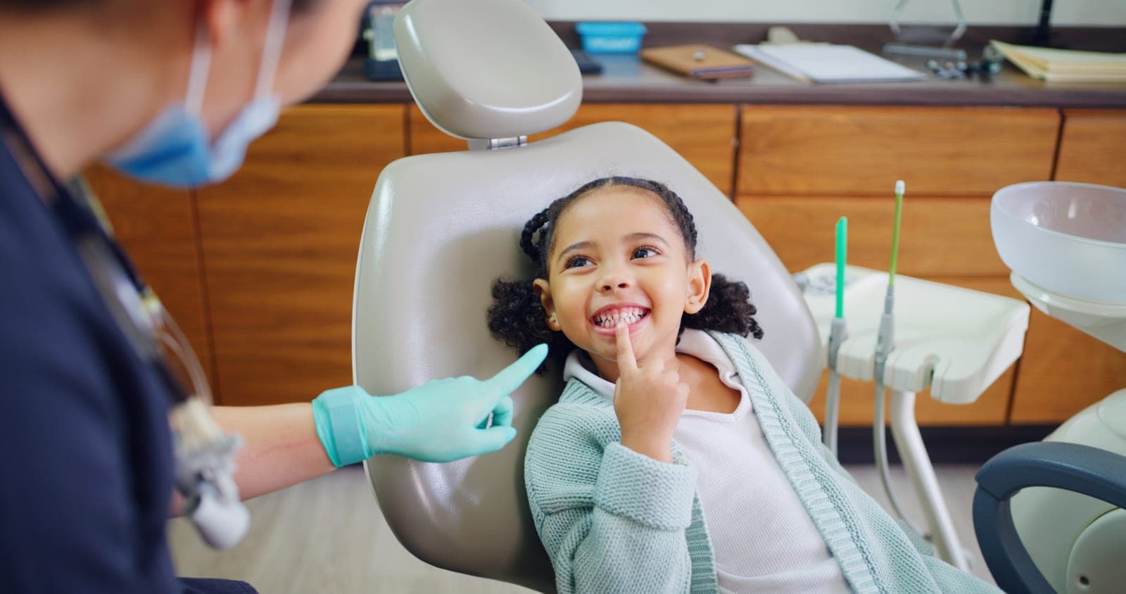 A child smiling during a friendly dental visit at Manor House Dental Practice