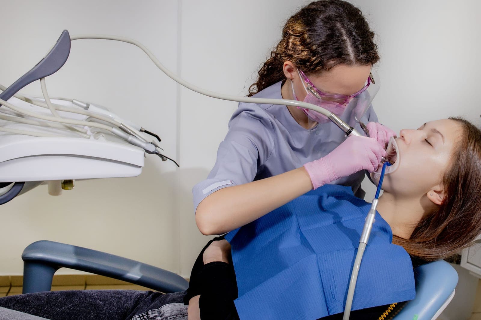A dental hygienist providing a professional clean at Manor House Dental Practice